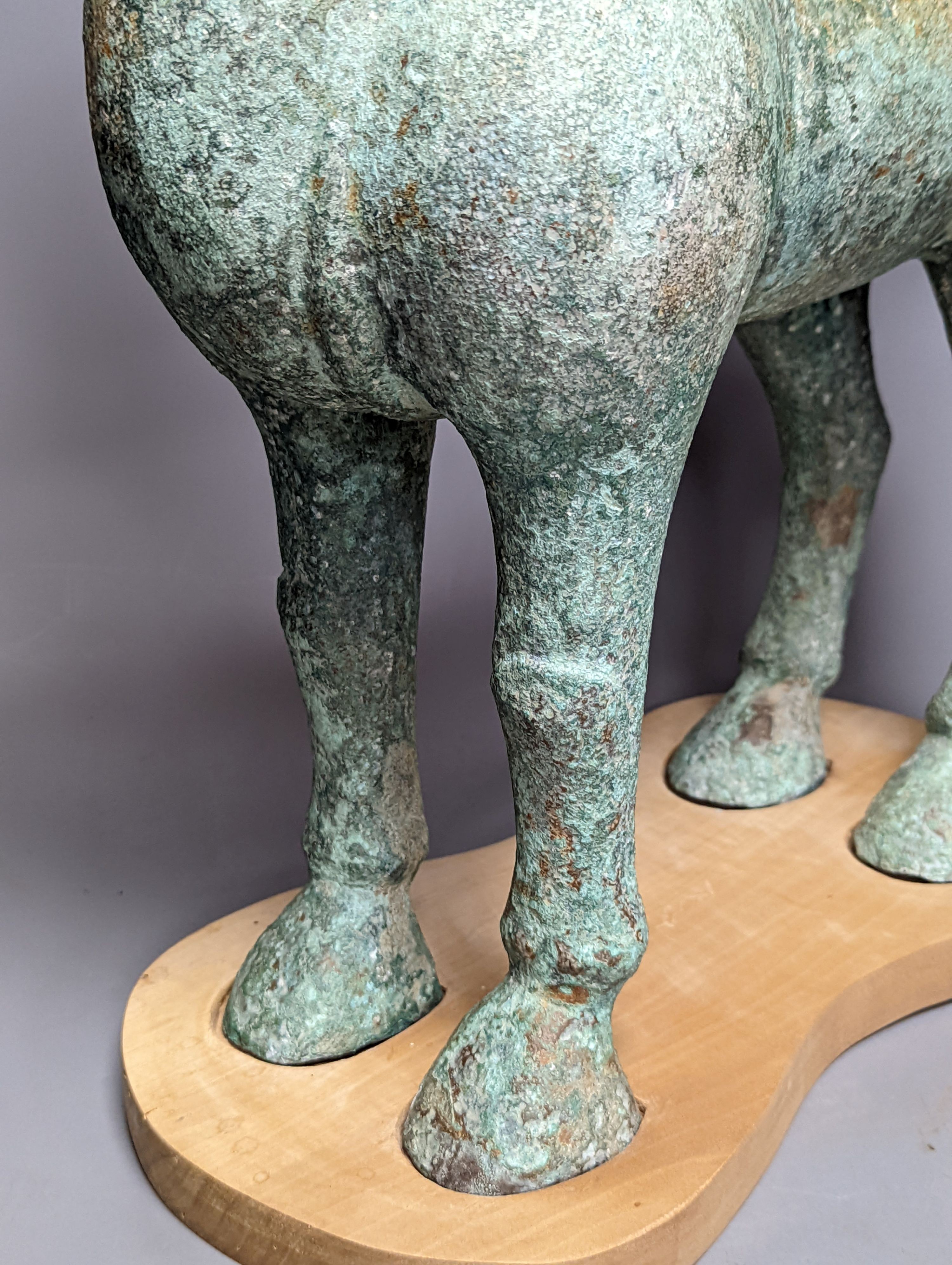 A large Chinese bronze figure of a horse, Han style 58cm